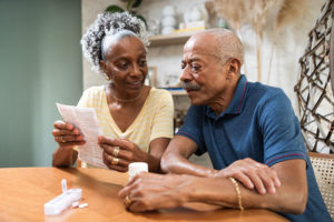 Senior couple looking at medication information